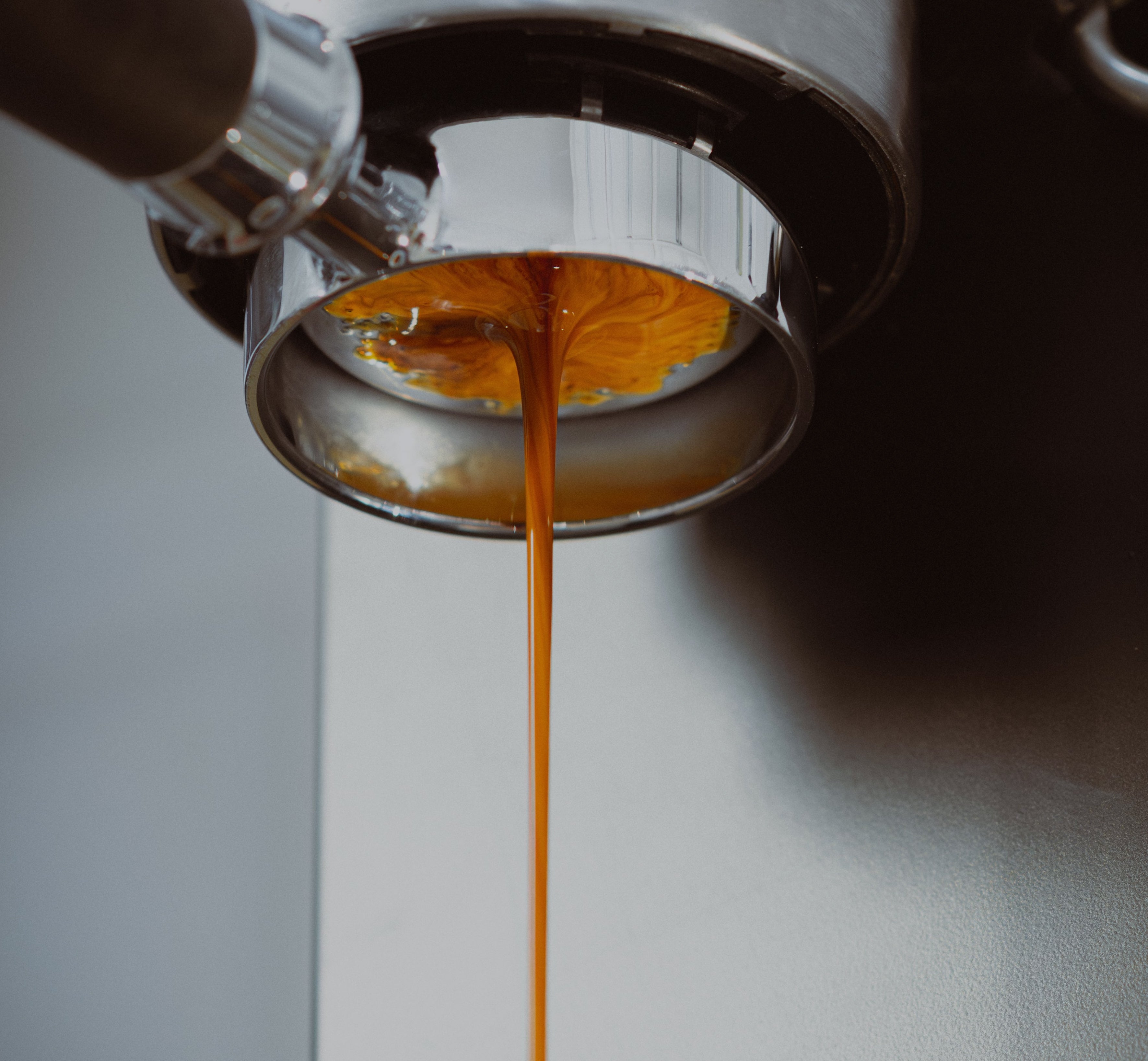 Coffee dripping out of naked portafilter